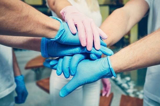 Gloved hands team reference