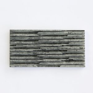 Black comb-tooth stone